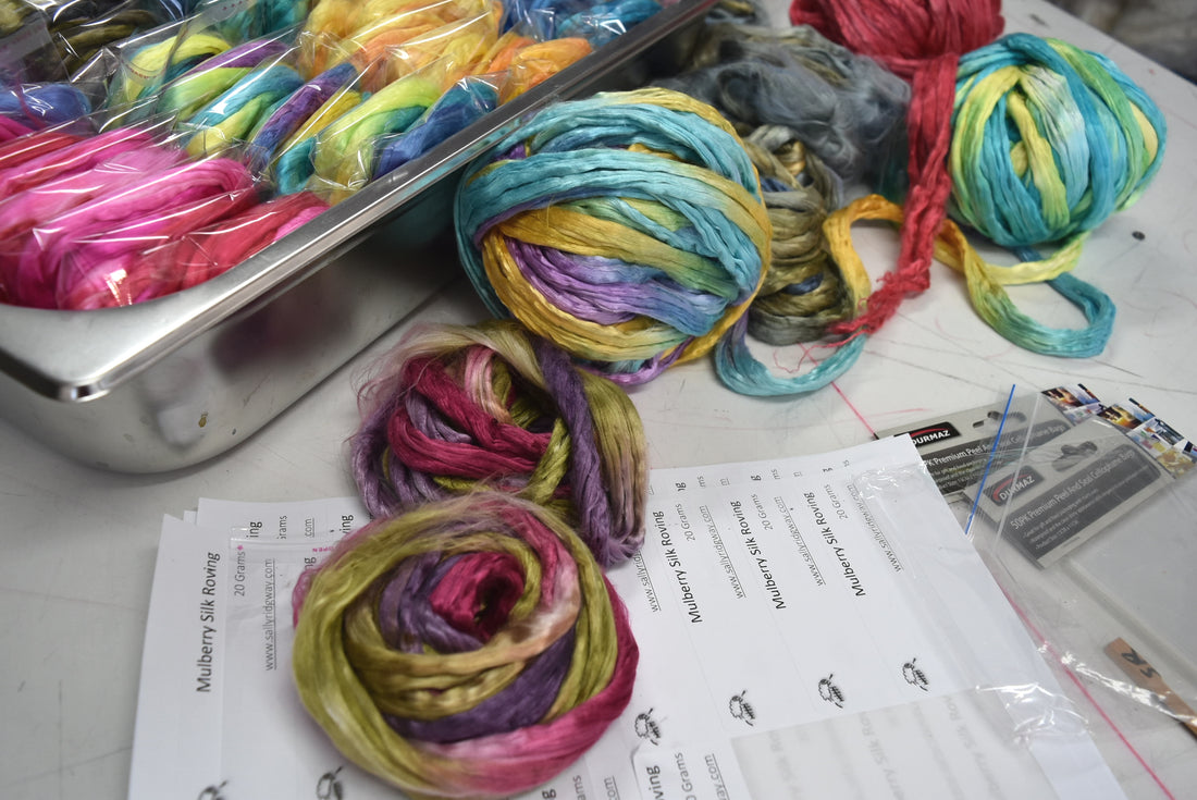 packing hand dyed silk for fibre arts carding and blending.