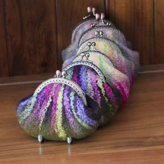 a row of wet felted coin purses hand made by sally ridgway designs